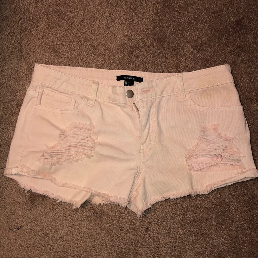 Light pink ripped jean shorts